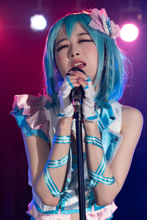 Japanese cosplayer Ria Kurumi sings on music stage while getting fucked from behind